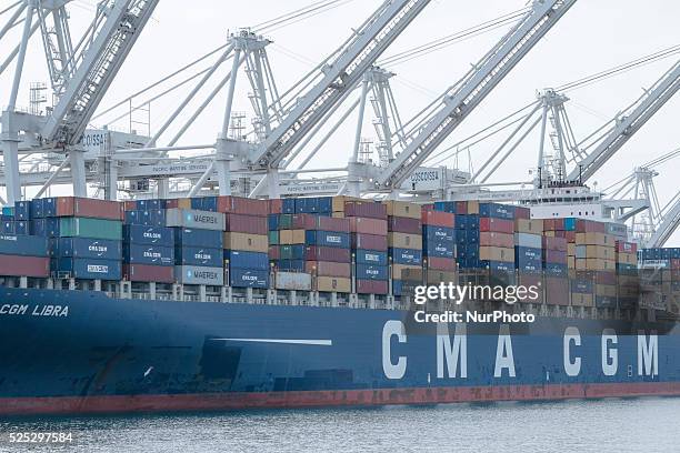 Full container ship waits to be unloaded in Long Beach harbor: Long Beach, CA 2-21-15 Numerous container and tanker ships are left to wait off the...