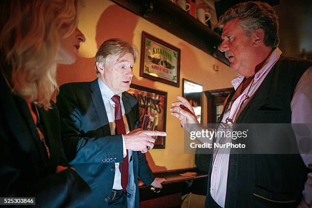State Secretary Martin van Rijn talks with the owner of the oldest pub in The Hague Bart van Dam during the kick off of the anti-smoking campaign.