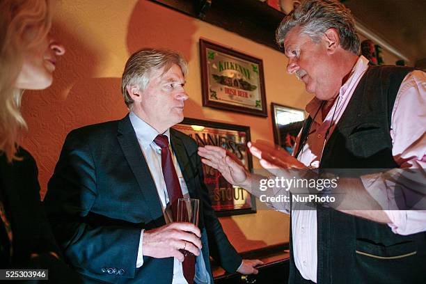 State Secretary Martin van Rijn talks with the owner of the oldest pub in The Hague Bart van Dam during the kick off of the anti-smoking campaign.