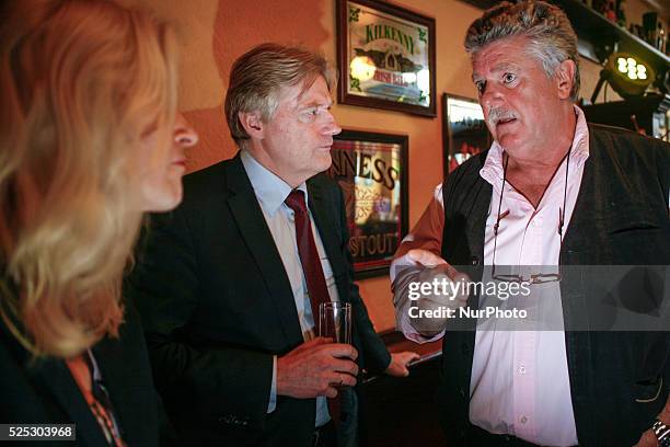 State Secretary Martin van Rijn talks with the owner of the oldest pub in The Hague Bart van Dam during the kick off of the anti-smoking campaign.