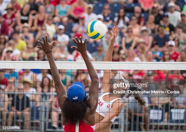 Melissa Humana-Paredes of Canada spikes the ball during Canada vs. Cuba in beach volleyball competition at the 2015 PanAm Games in Toronto.