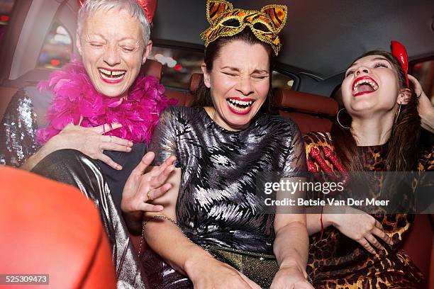 senior women and daughter laughing in car. - verkleden stockfoto's en -beelden