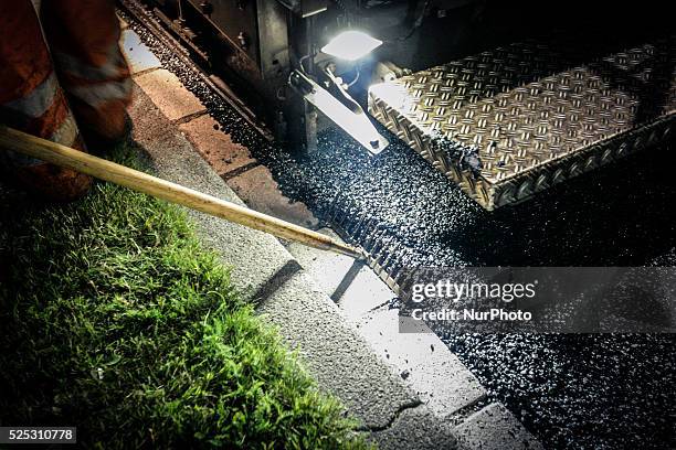 The Netherlands - Part of the entrance road to the university city is given a new top layer of asphalt. Such work is increasingly being done at...