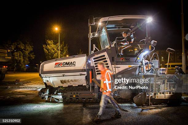 The Netherlands - Part of the entrance road to the university city is given a new top layer of asphalt. Such work is increasingly being done at...