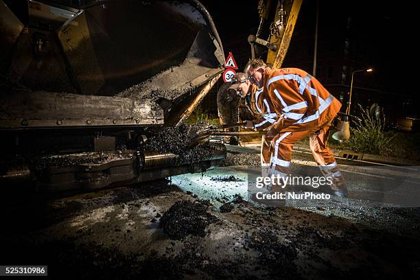 The Netherlands - Part of the entrance road to the university city is given a new top layer of asphalt. Such work is increasingly being done at...