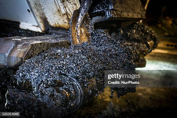 The Netherlands - Part of the entrance road to the university city is given a new top layer of asphalt. Such work is increasingly being done at...