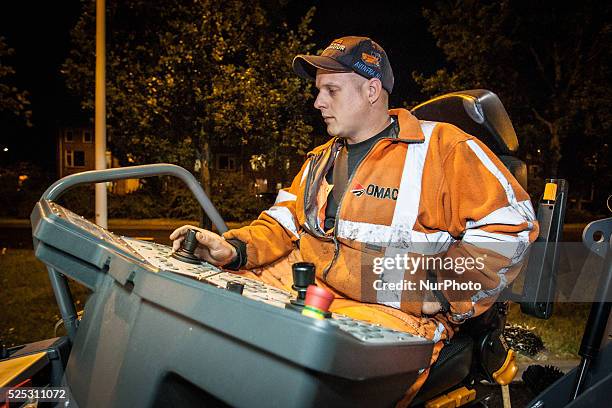 The Netherlands - Part of the entrance road to the university city is given a new top layer of asphalt. Such work is increasingly being done at...