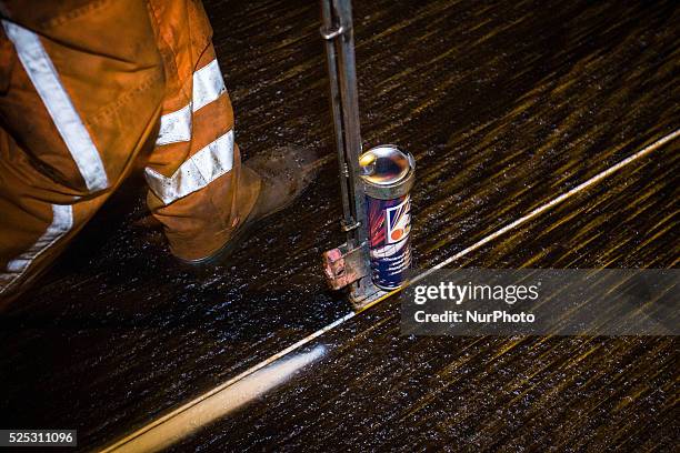 The Netherlands - Part of the entrance road to the university city is given a new top layer of asphalt. Such work is increasingly being done at...