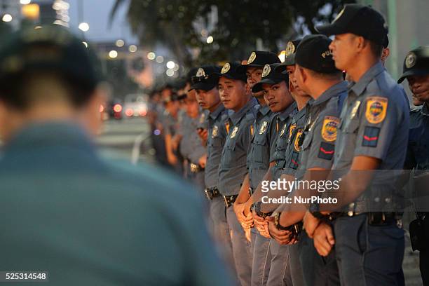 Manila, Philippines - Police officers lineup along Roxas Boulevard for a dry run on Pope Francis' arrival in Manila on Monday, January 12, 2015. The...
