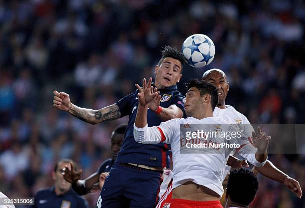 Atletico de Madrid's Uruguayan Defender Jose Maria Gimenez and Benfica's Brazilian Defender Luisao during the Champions League 2015/16 match between...