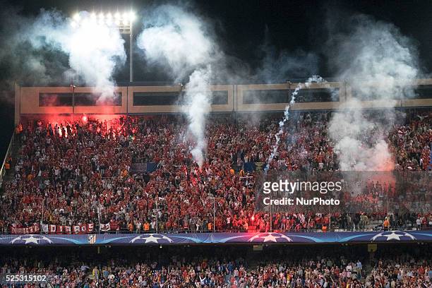 Benfica supporters light flares, during the UEFA Champions League group C soccer match between Atletico Madrid and Benfica Lisbon at Vicente Calderon...