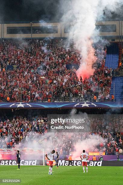 Benfica supporters light flares, during the UEFA Champions League group C soccer match between Atletico Madrid and Benfica Lisbon at Vicente Calderon...