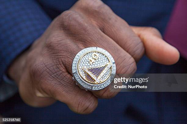 Golden State Warriors player Harrison Barnes shows his championship ring outside of the West Wing of the White House.