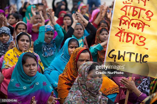 Workers of AMCS Textile at Adamzee EPZ take part in a demonstration in front of National Press Club on February 27, 2015 in Dhaka, following the...