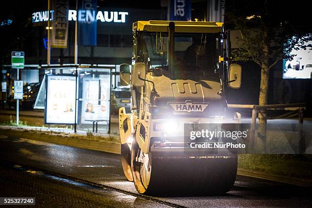 The Netherlands - Part of the entrance road to the university city is given a new top layer of asphalt. Such work is increasingly being done at...