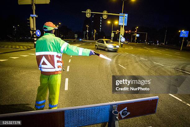 The Netherlands - Part of the entrance road to the university city is given a new top layer of asphalt. Such work is increasingly being done at...