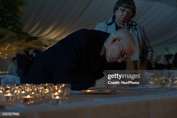 Person signing the book of condolence at the service for Alan Henning.