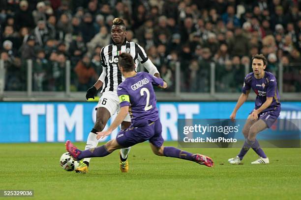 Paul Pogba and Gonzalo Rodriguez during Coppa Italia-Tim Cup semifinal between Juventus FC and ACF Fiorentina at Juventus Stafium on march 5, 2015 in...