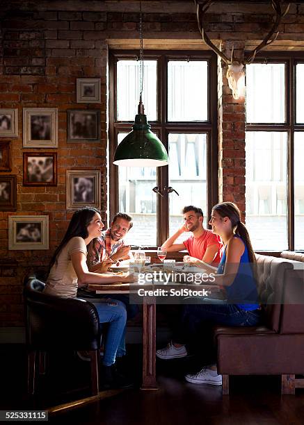 friends in the pub - champaign illinois stock pictures, royalty-free photos & images