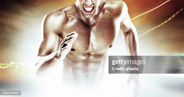 muscular sprinter. - attack sporting position stock pictures, royalty-free photos & images