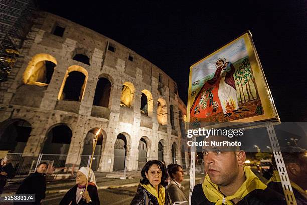 Thousands of Gypsies attend celebrations of the Via Crucis outside the Colosseum in Rome on October 24, 2015. Thousands of Gypsies have come from all...