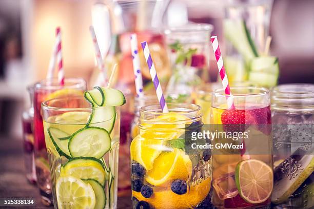 variation of infused water with fresh fruits - drink stock pictures, royalty-free photos & images