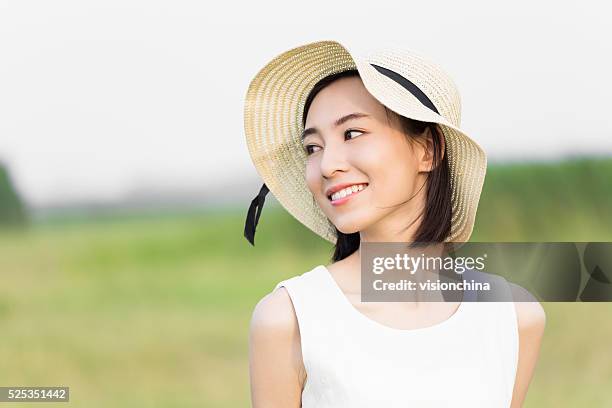 girl wearing a white dress - sun hat stock pictures, royalty-free photos & images