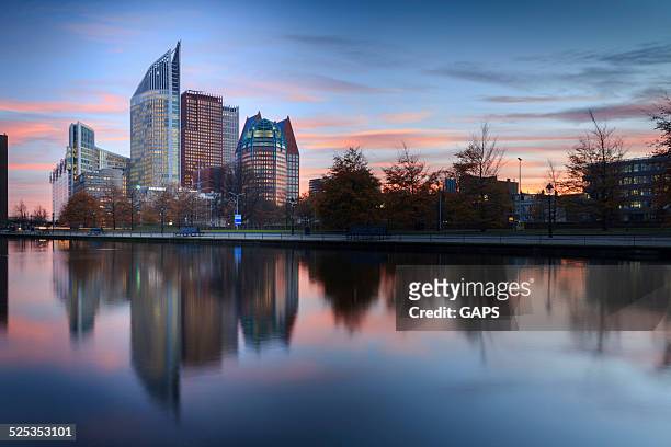 skyline of the hague with its modern architecture at dusk - the hague stock pictures, royalty-free photos & images