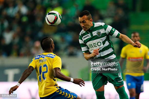 Sporting's defender Jefferson heads for the ball with Estoril's defender Mano during the Portuguese League football match between Sporting CP and...