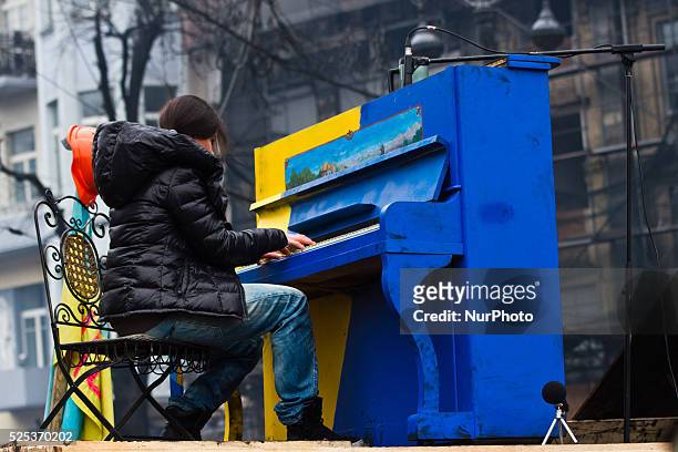 Ukrainian artist Ruslana Lyzhychko plays a piano set on the anti-government opposition barricade in Kiev during ca oncert organized for the activists...