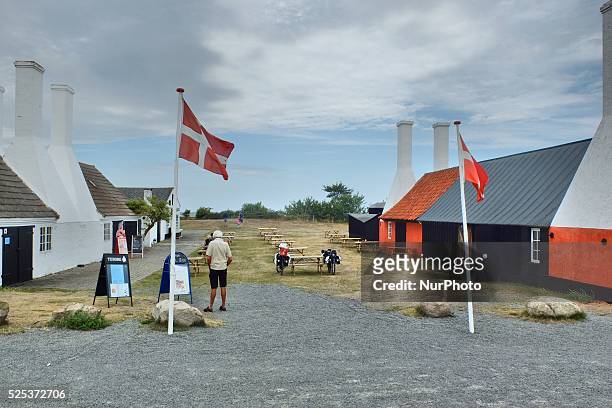 Denmark, Bornholm Island Pictures taken between 1st and 5th August 2014. Pictured: Herring smokehouse at Hasle City, with Danish flags on the front