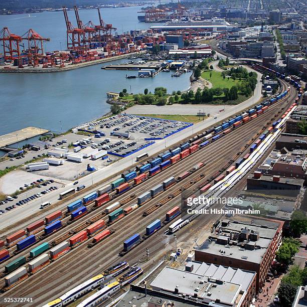 cranes and shipping containers at vancouver port - vancouver harbour stock pictures, royalty-free photos & images