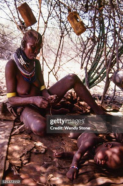 The Turkana, a nomadic pastoral Nilotic people, live in the harsh semi-arid desert and raise camels, sheep and goats for their survival. The Turkana...
