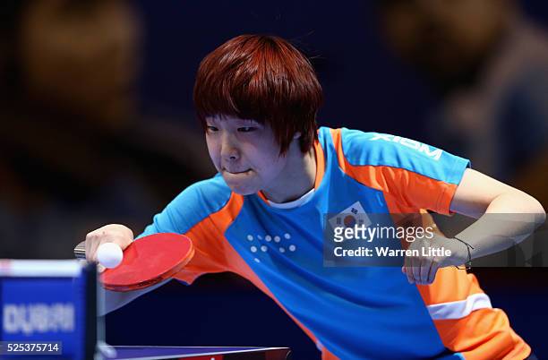 Lee Zion of Korea in action against Miu Hirano of Japan during day one of the Nakheel Table Tennis Asian Cup 2016 at Dubai World Trade Centre on...