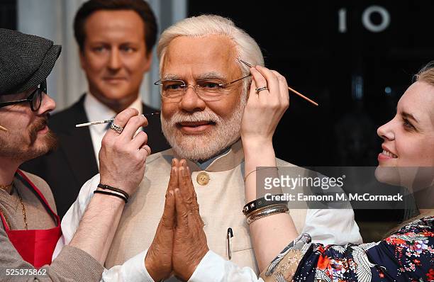 Madame Tussauds studio artists put the finishing touches on new wax figure of Narendra Modi, Prime Minister of India as it joins World leaders...
