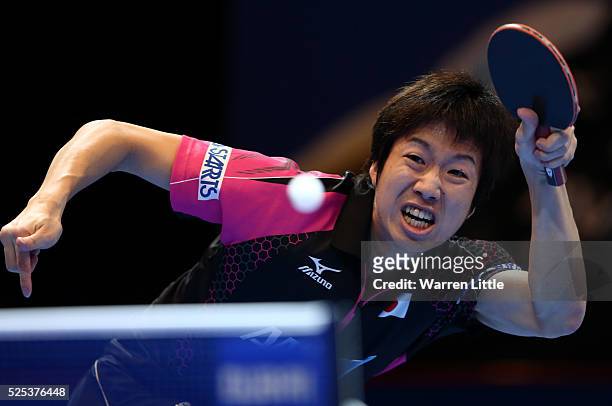 Jun Mizutani of Japan in action against Ho Kwan Kit of Hong Kong during day one of the Nakheel Table Tennis Asian Cup 2016 at Dubai World Trade...