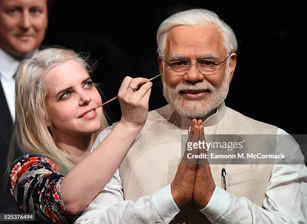 Madame Tussauds studio artist puts the finishing touches on new wax figure of Narendra Modi, Prime Minister of India as it joins World leaders...