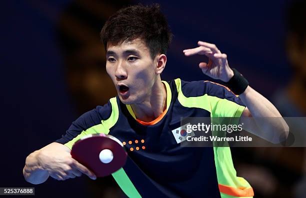 Lee Sangsu of Korea in action against Zhang Jike of China during day one of the Nakheel Table Tennis Asian Cup 2016 at Dubai World Trade Centre on...