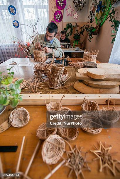 Boys with mental disorders make willow baskets in the class of working therapy, Teterivka's Orphanage and Boarding school. Zhytomyr, Ukraine. 2 of...