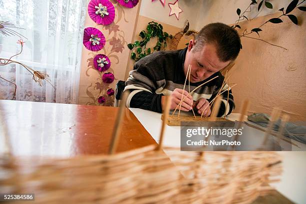 Boy with Down's syndrome canes willows in the class of working therapy, Teterivka's Orphanage and Boarding school. Zhytomyr, Ukraine. 2 of February,...