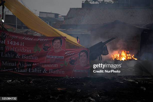 Poster of a party of the president candidate use as tent by the victim of the burn houses. After big fire hit the slum area in Gandaria-South...
