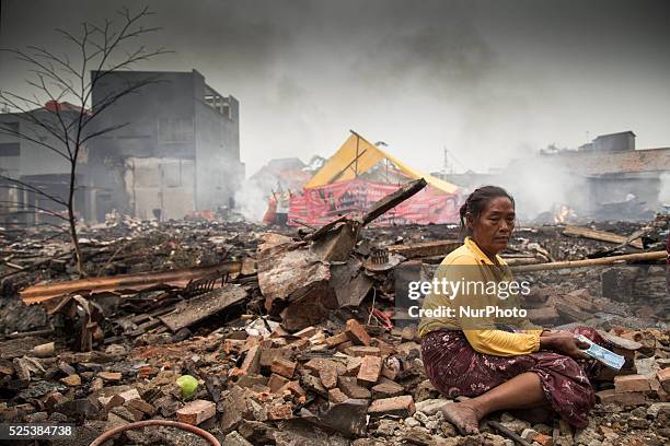 Mrs. Rohimaha one the burn houses victim received ammount of money from Indonesian who saw her picture at corbis site, still she haven't visitted by...
