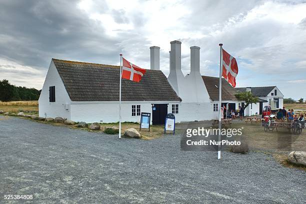 Denmark, Bornholm Island Pictures taken between 1st and 5th August 2014. Pictured: Herring smokehouse at Hasle City, with Danish flags on the front