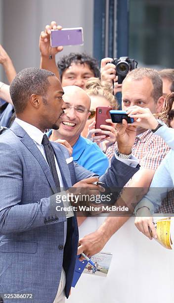 Anthony Mackie with fans as he arrives at the 'Black and White' premiere during the 2014 Toronto International Film Festival at Roy Thomson Hall on...