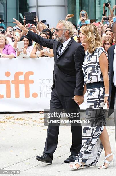 Christine Baumgartner; Kevin Costner arrive at the 'Black and White' premiere during the 2014 Toronto International Film Festival at Roy Thomson Hall...
