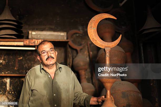 Gaza, Palestine on June 20, 2015 Mohammed Abdo in 53 -year-old works copper industry inherited this profession from his father for nearly 40 years ....