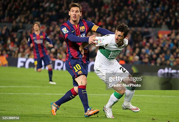 January- SPAIN: Leo Messi and Damian in the match between FC Barcelona and Elche CF, for the first leg of the round of 16 of the spanish King Cup,...