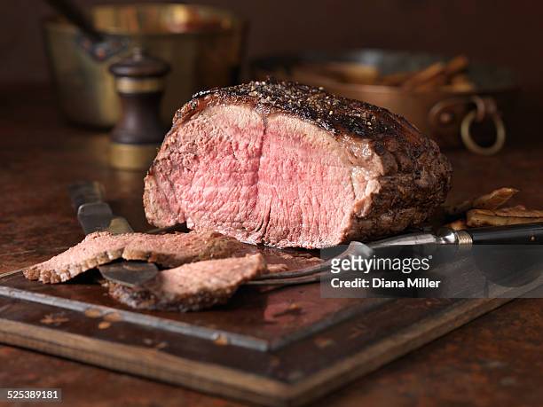 christmas dinner. 28 day matured sirloin of beef served rare medium with roasted parsnips - carvery stockfoto's en -beelden