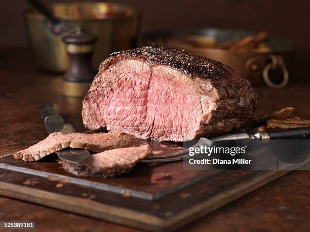 christmas dinner. 28 day matured sirloin of beef served rare medium with roasted parsnips - carvery stock pictures, royalty-free photos & images