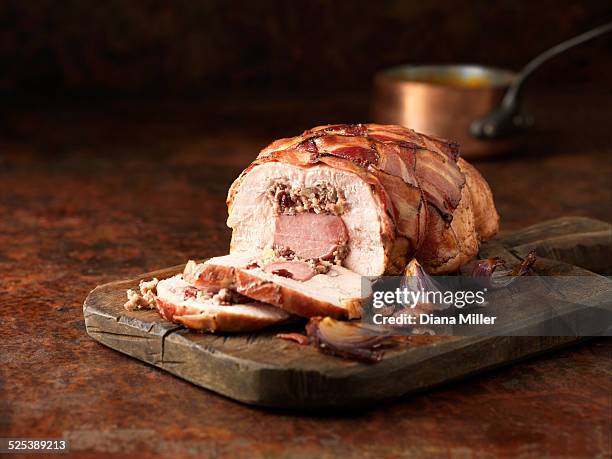 christmas dinner. turkey & gammon roast with pork, apple & cranberry stuffing with red onions - roasted red onion fotografías e imágenes de stock